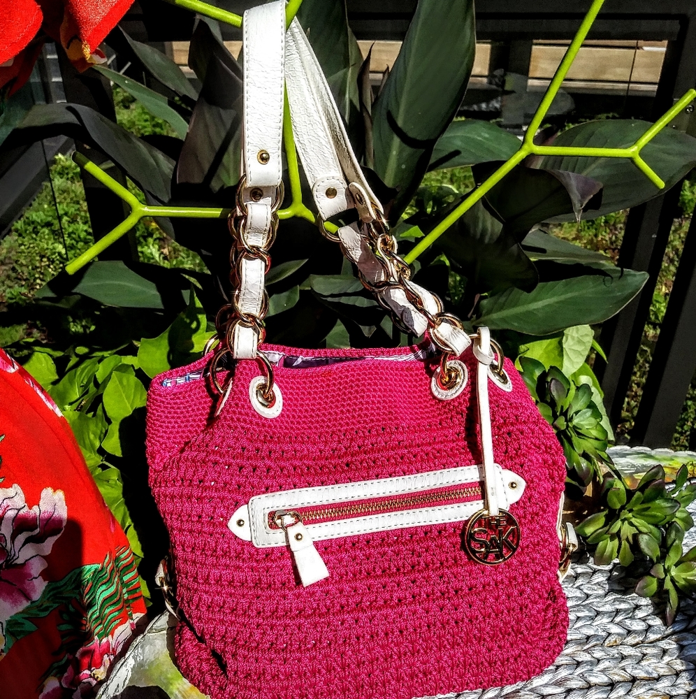 The Sak fuschia crocheted purse w/gold accents NWT